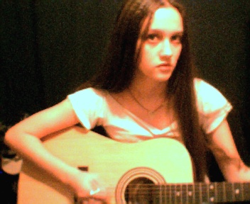 me...playing Jenny's crappy guitar :P